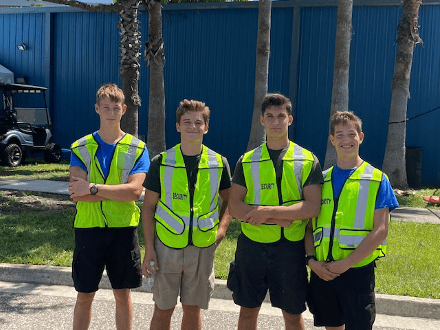 A Group Of Teens Wearing Reflective Vests